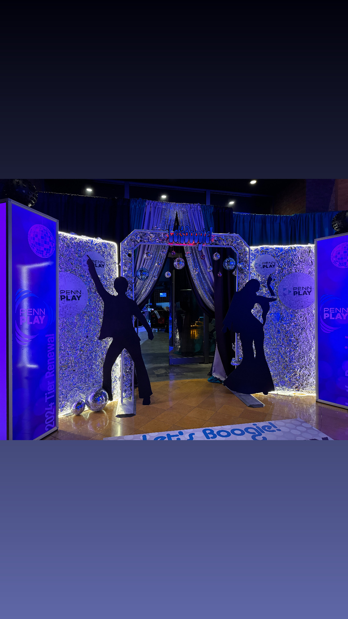Disco event entrance with sparkling walls and disco balls