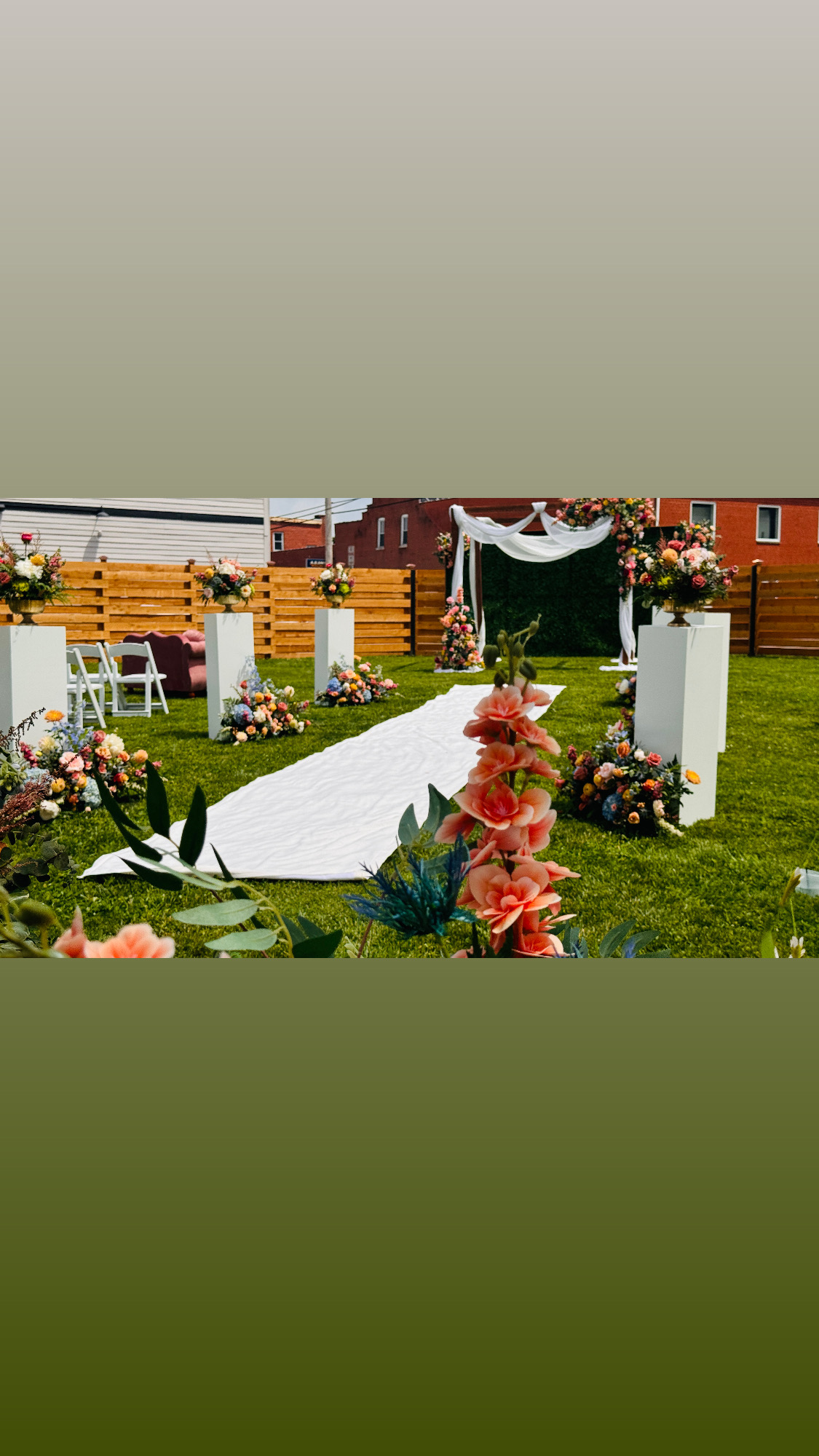 Outdoor wedding ceremony with custom florals